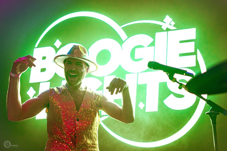 Person in front of neon lights.