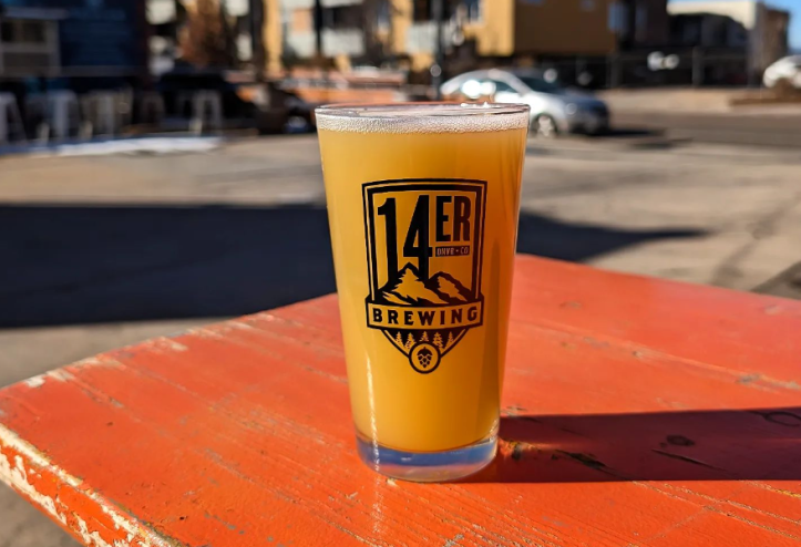 glass of beer on wood table