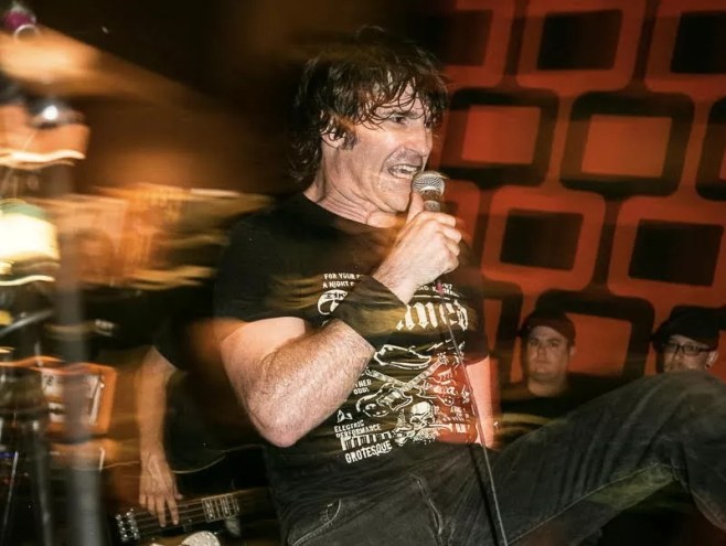 Abe Brennan singing onstage