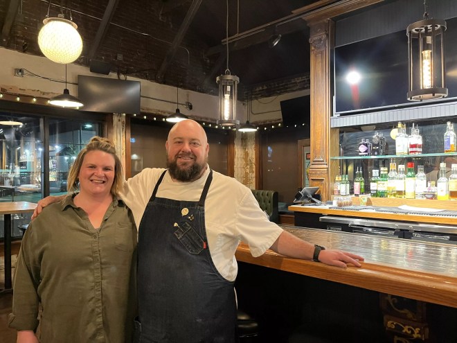 woman and man in a apron posing