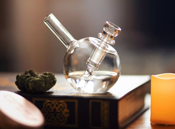 mini glass bong and marijuana bud