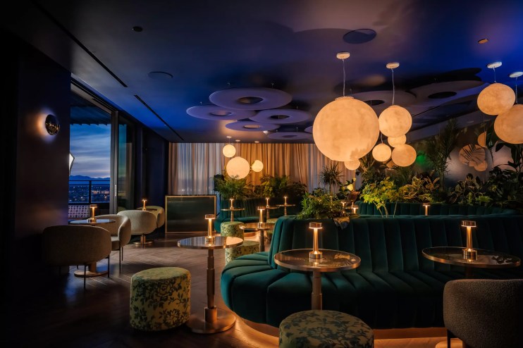 teal booths inside a bar