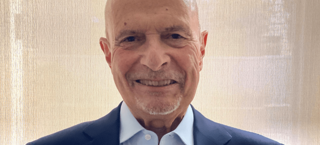 elderly man looking at camera.