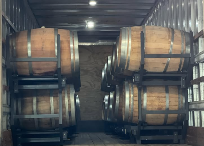 wine barrels loaded in a truck