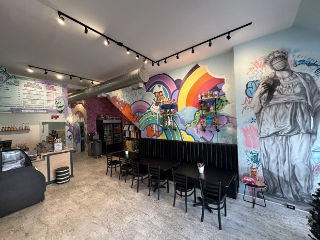 interior of an ice cream shop with colorful murals