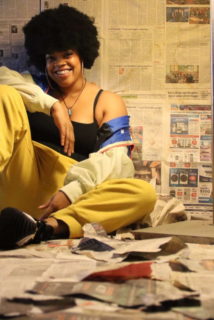 woman posing with books