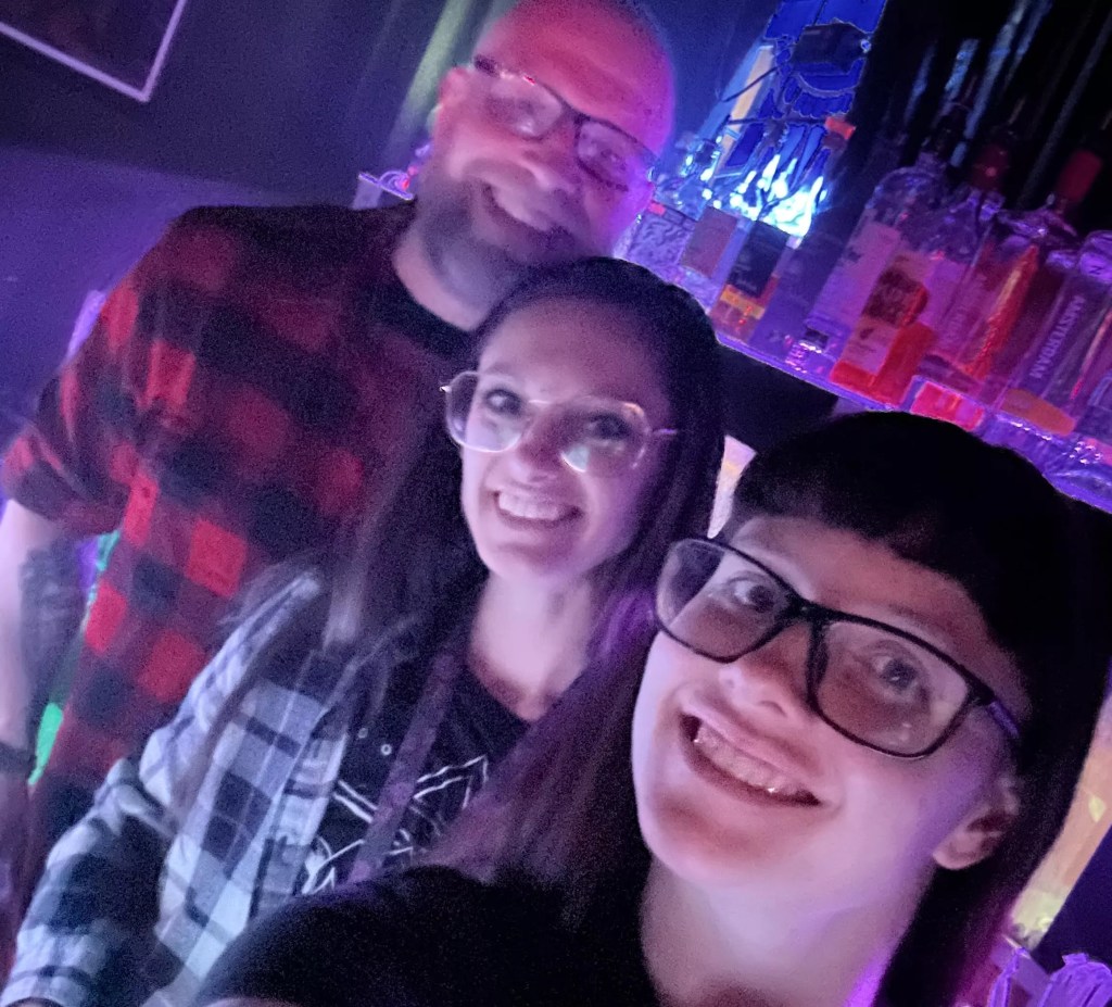 Jillian Johnson standing with two of her employees