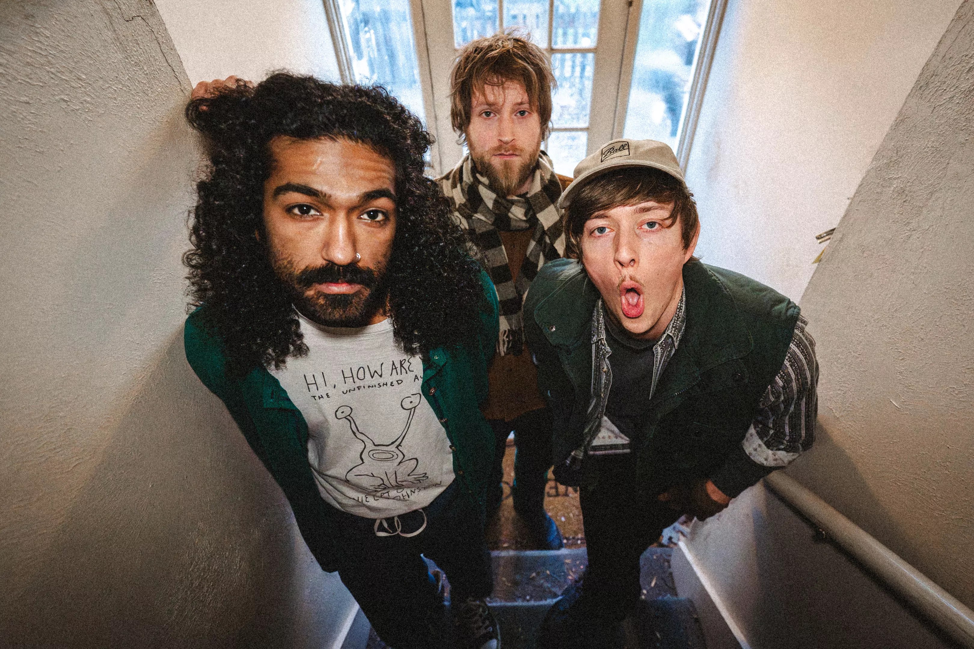 three men in a stairway