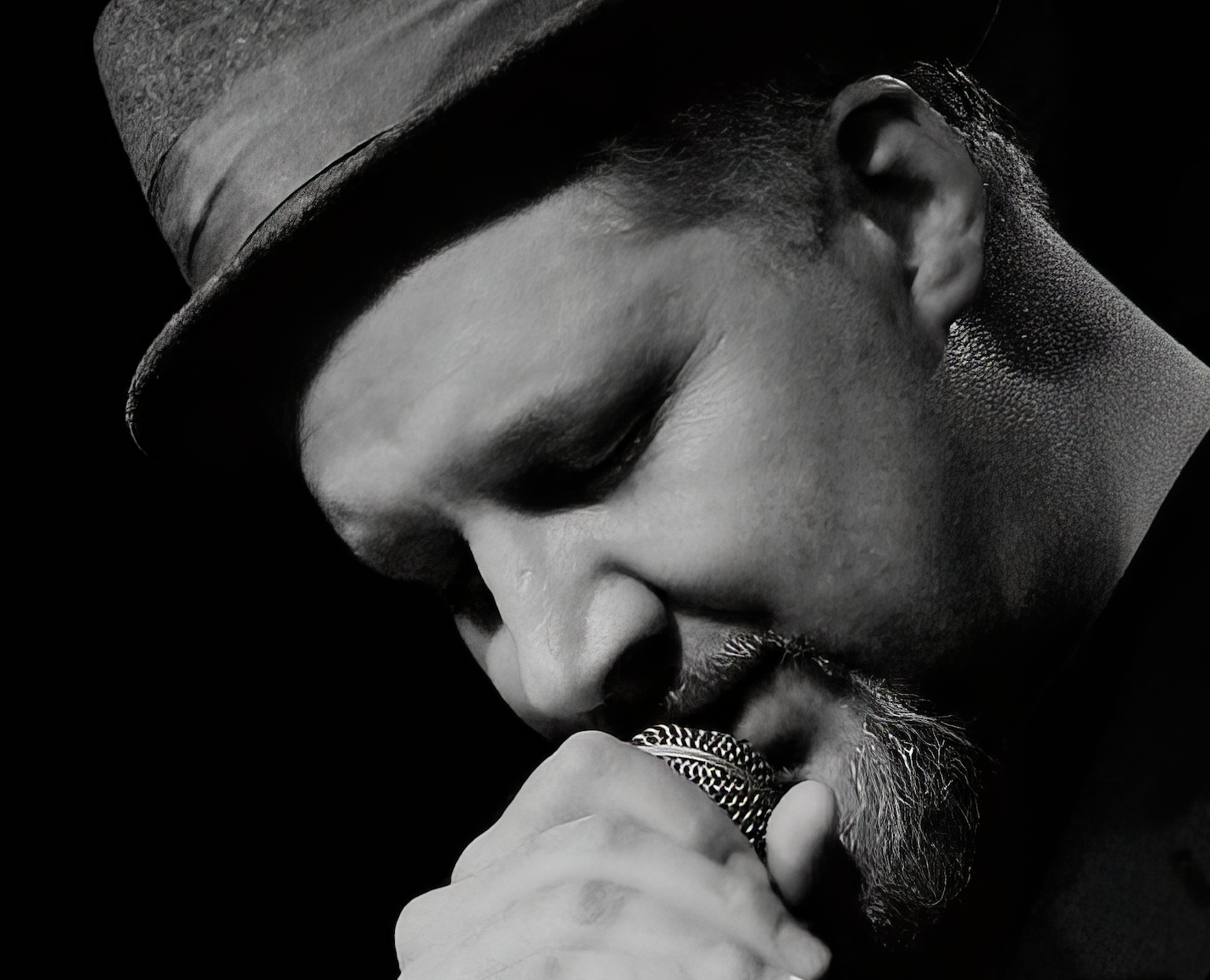 David Dinsmore singing into a microphone