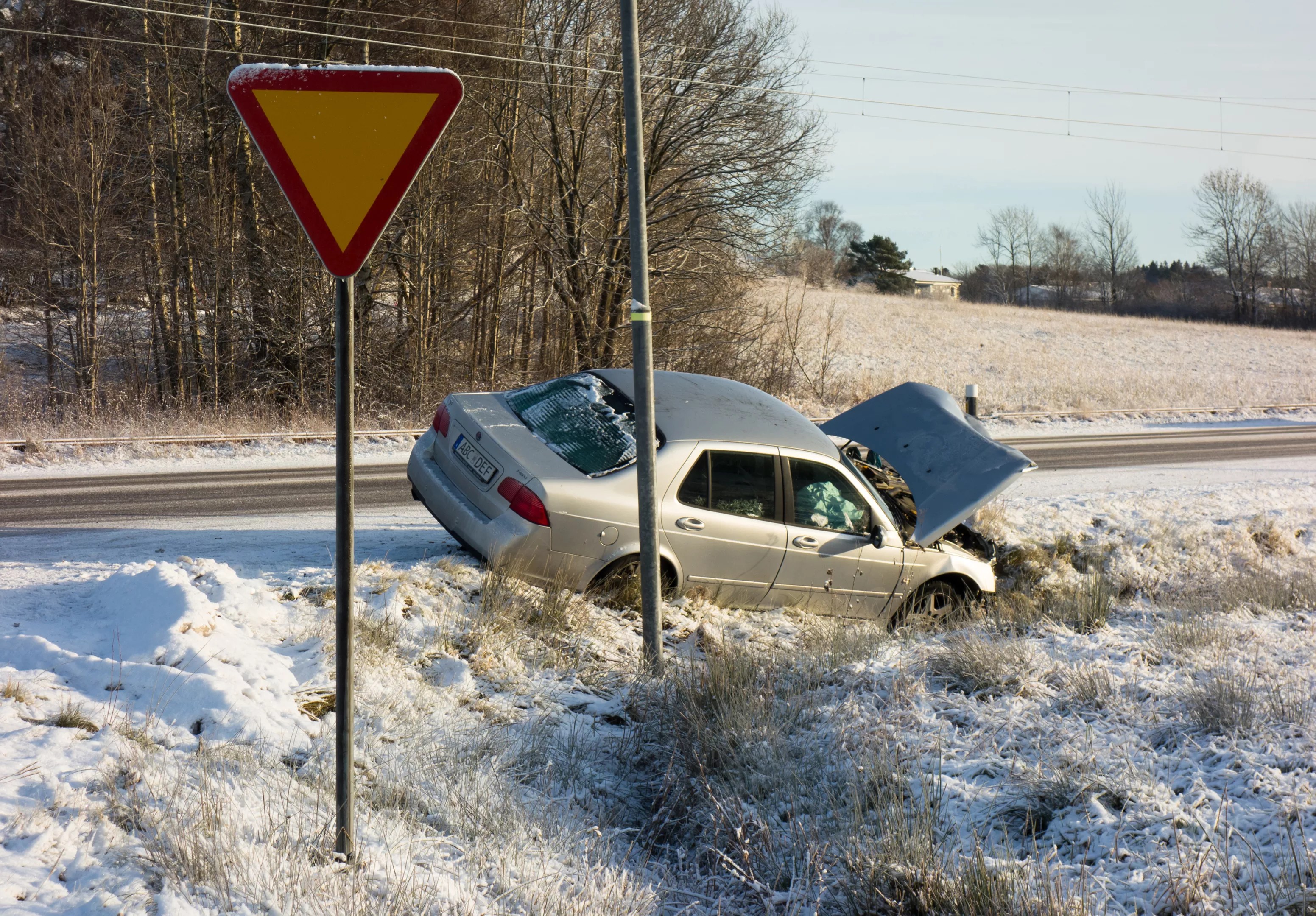 car crashes into snowy hill