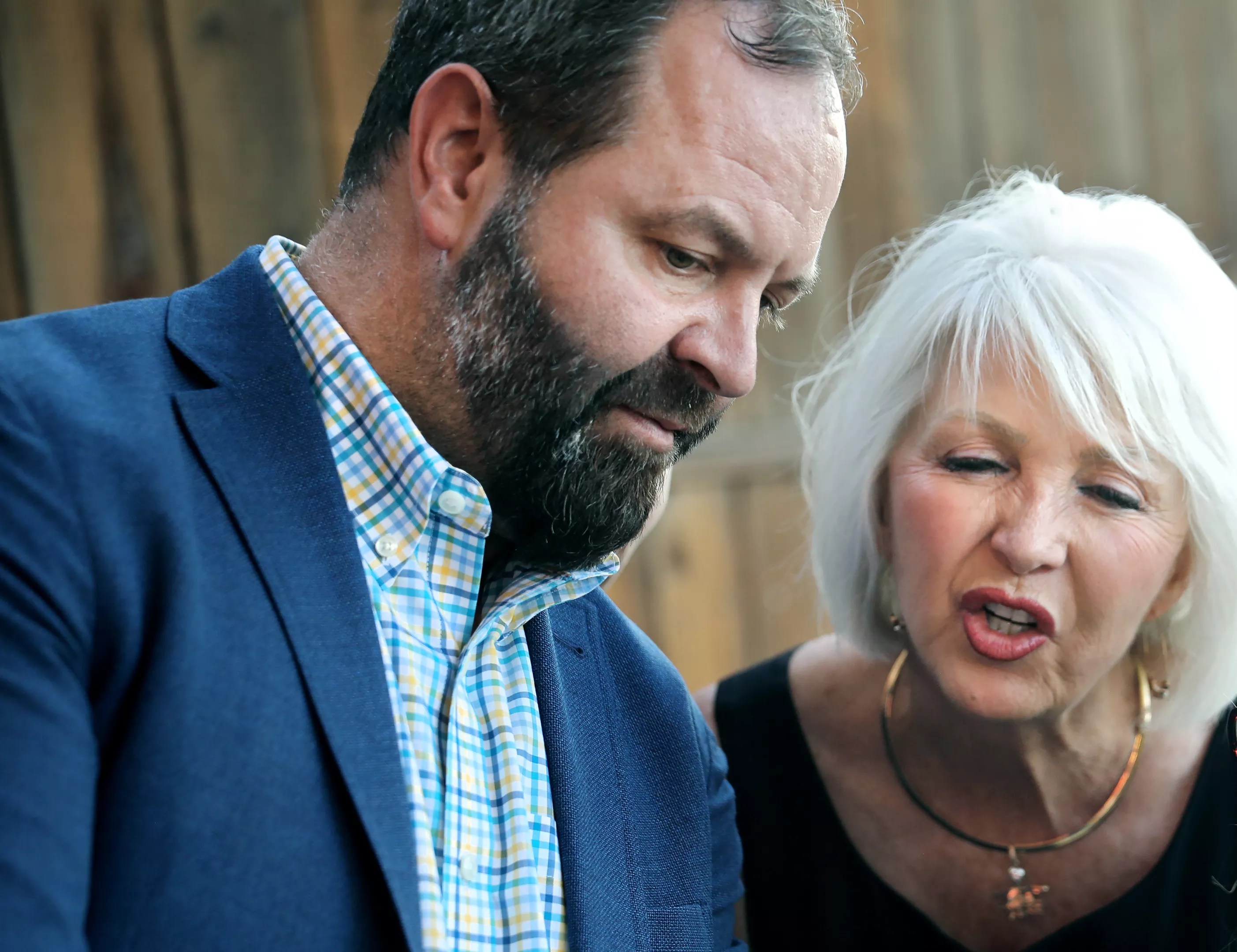 man with beard in jacket with blonde woman