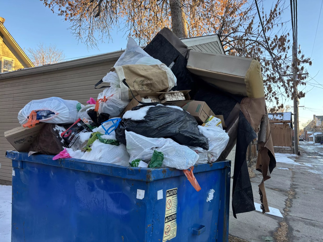 overflowing trash form dumpster