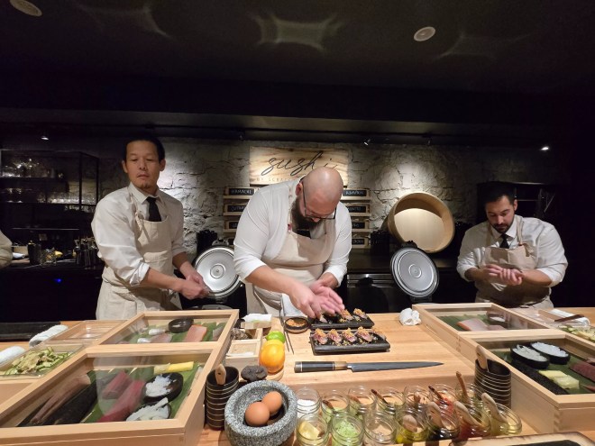 chefs working behind a counter