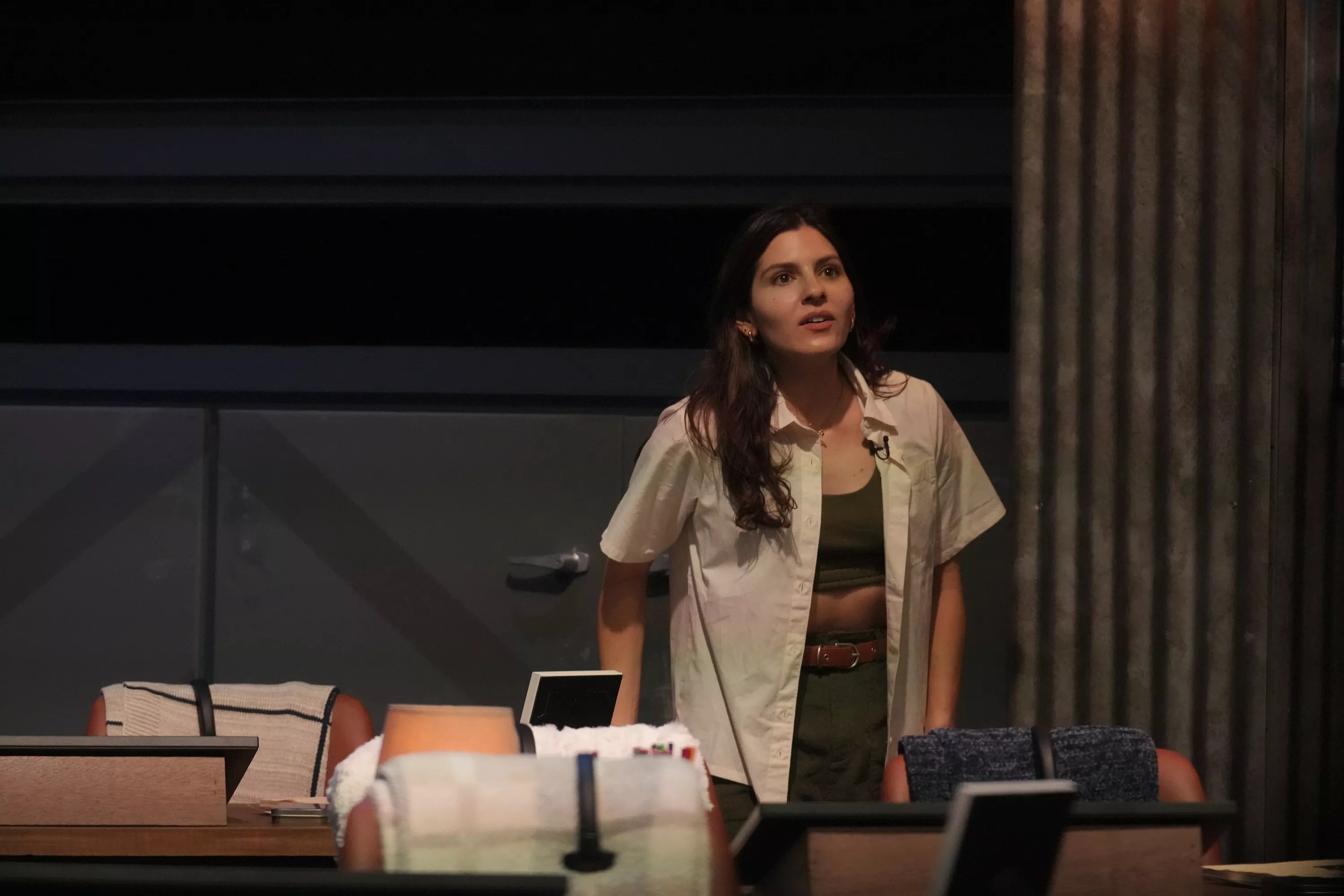 Kelsey Nichols dressed in a green and beige hiking outfit at the Extracted headquarters.