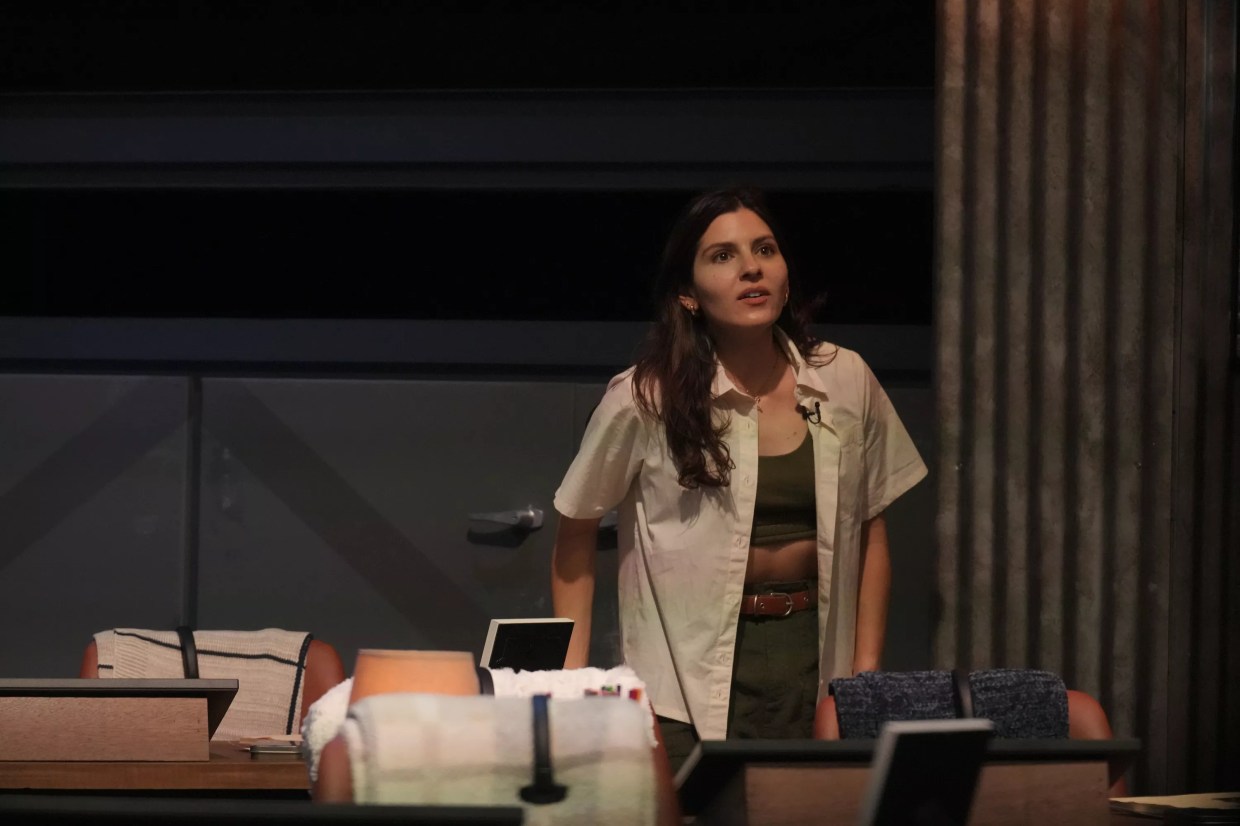 Kelsey Nichols dressed in a green and beige hiking outfit at the Extracted headquarters.