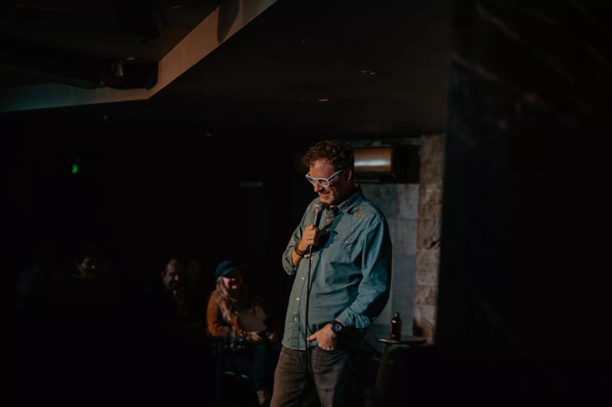 A man performs onstage.