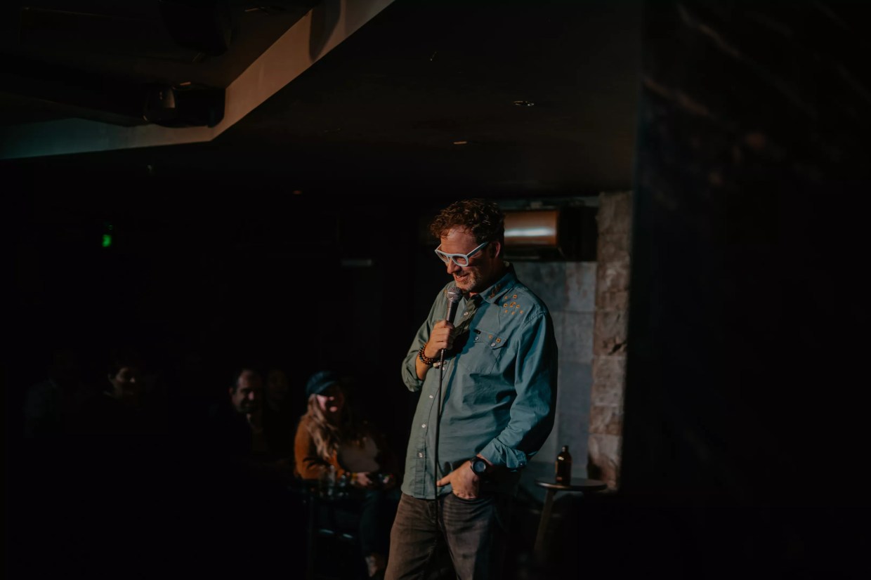 A man performs onstage.