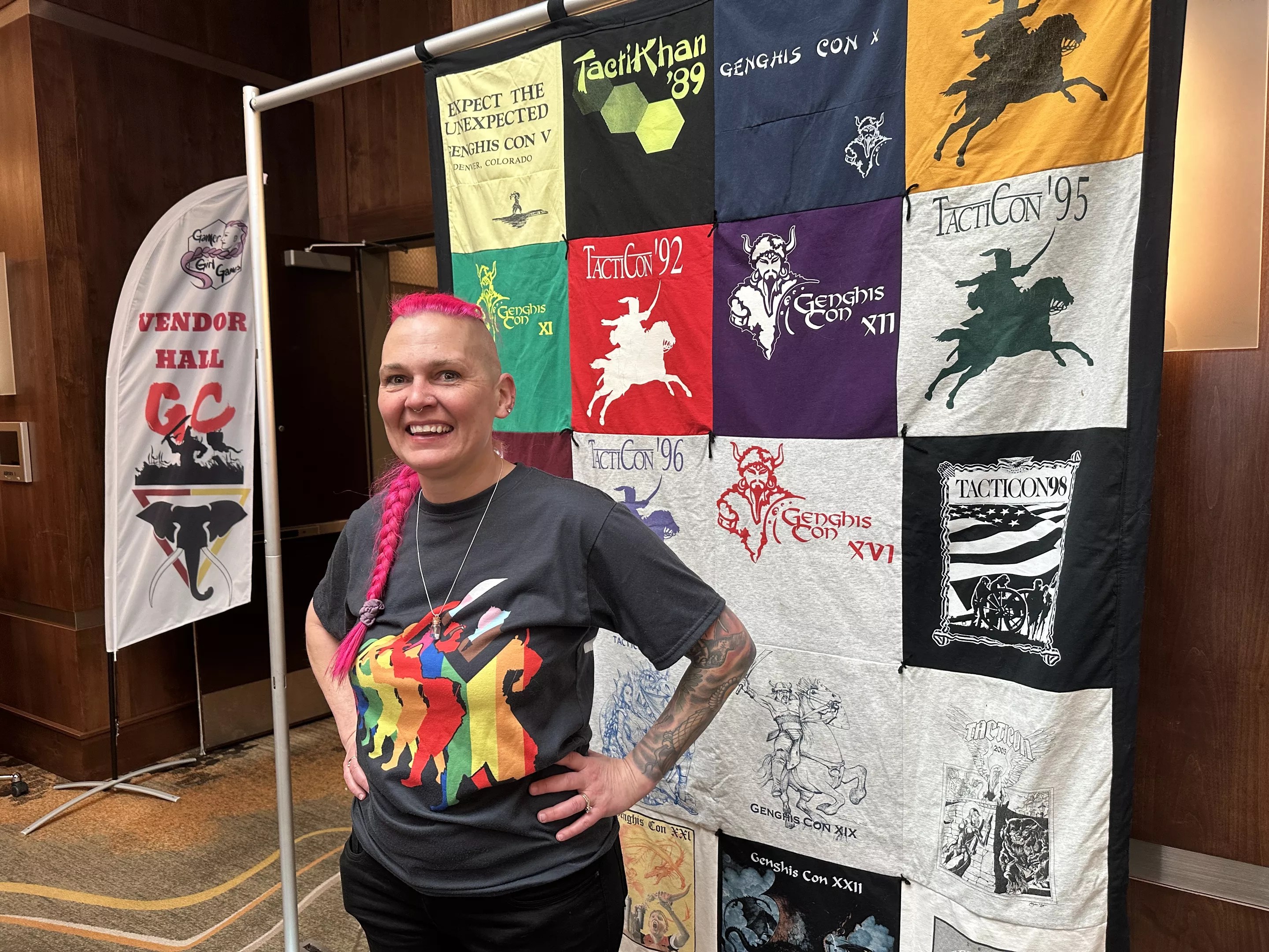 A person stands in front of art