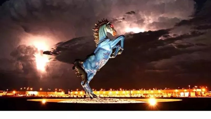 blue horse statue in storm