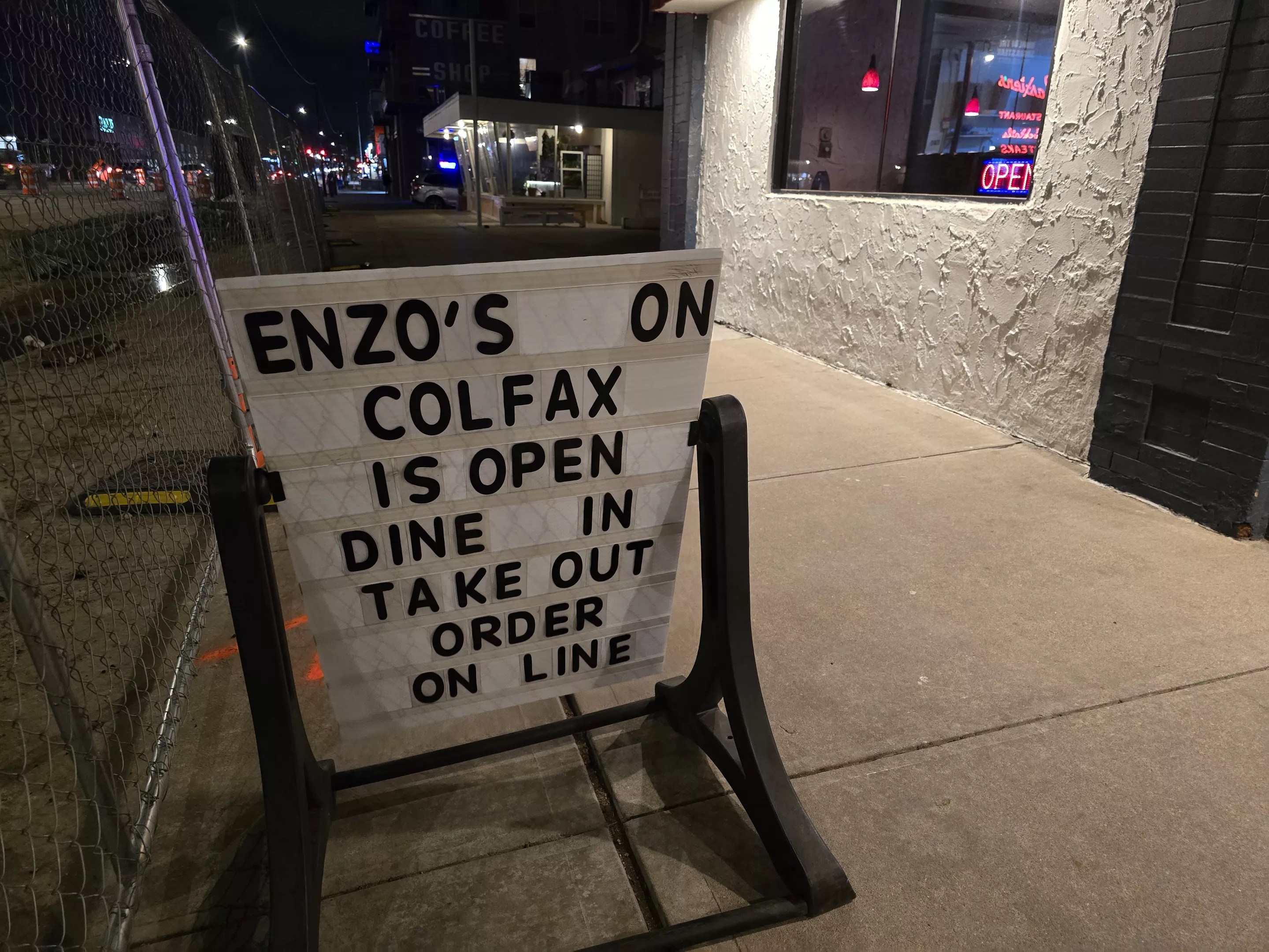 white sign with black letters