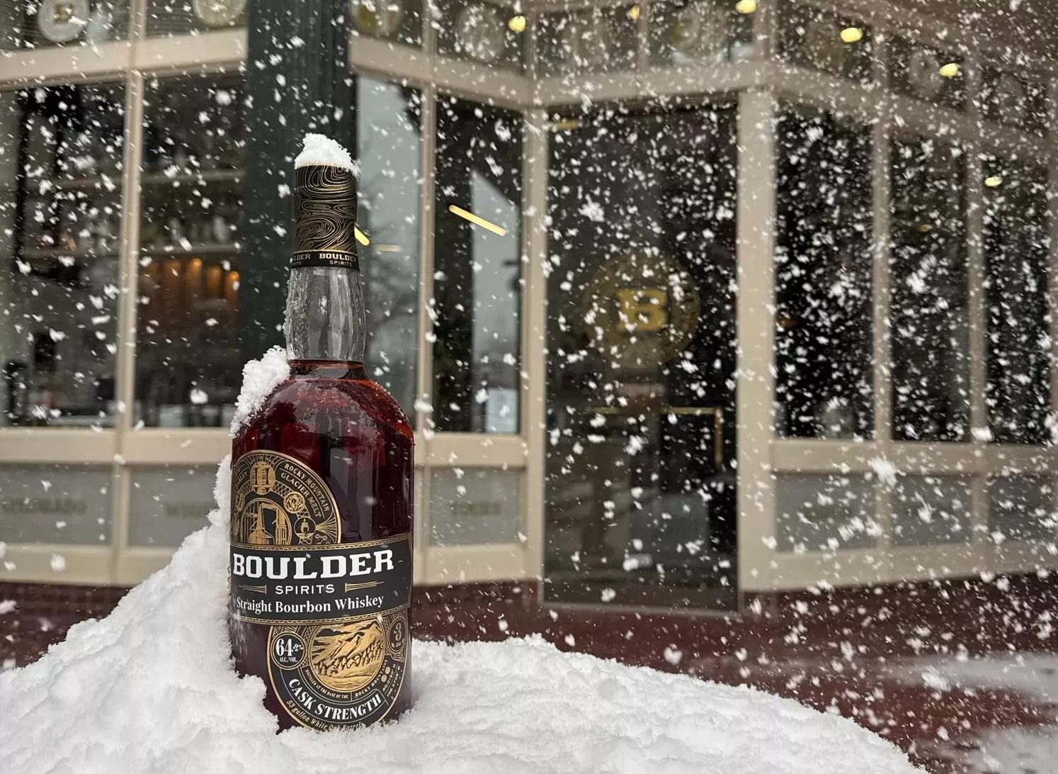 bottle of bourbon in the snow