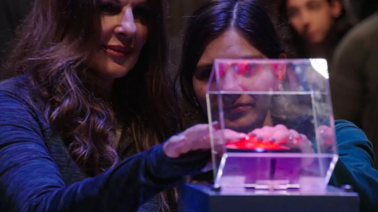 Foster and Nichols both pressing the red "extract" button