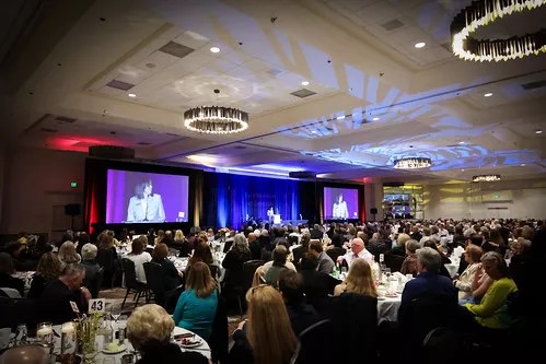 group in dining room for awards ceremony