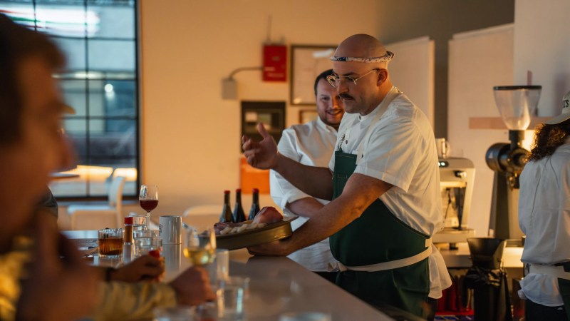 a chef behind a counter