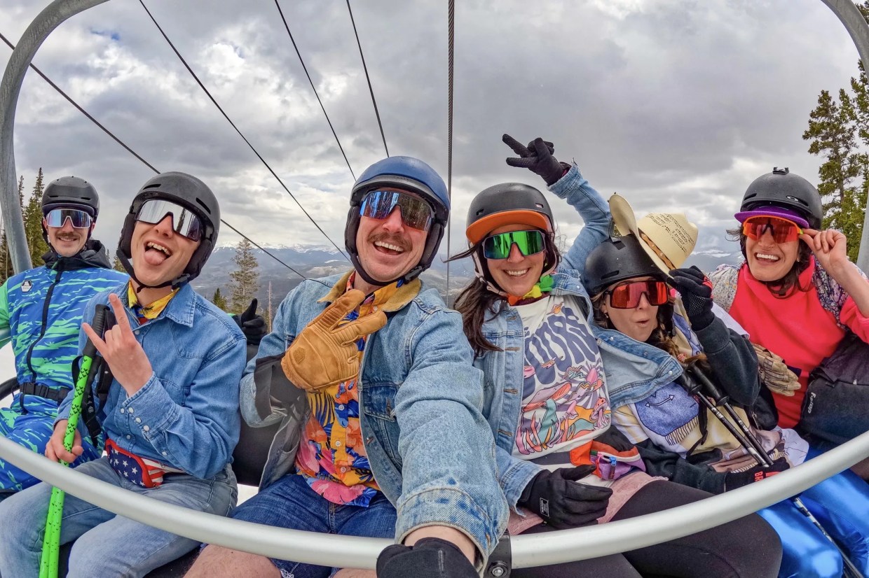 A group of six skiers in spring attire on a Breckenridge Ski Resort lift