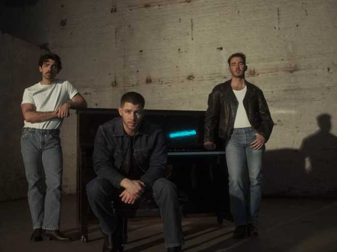 members of the Jonas Brothers looking moody