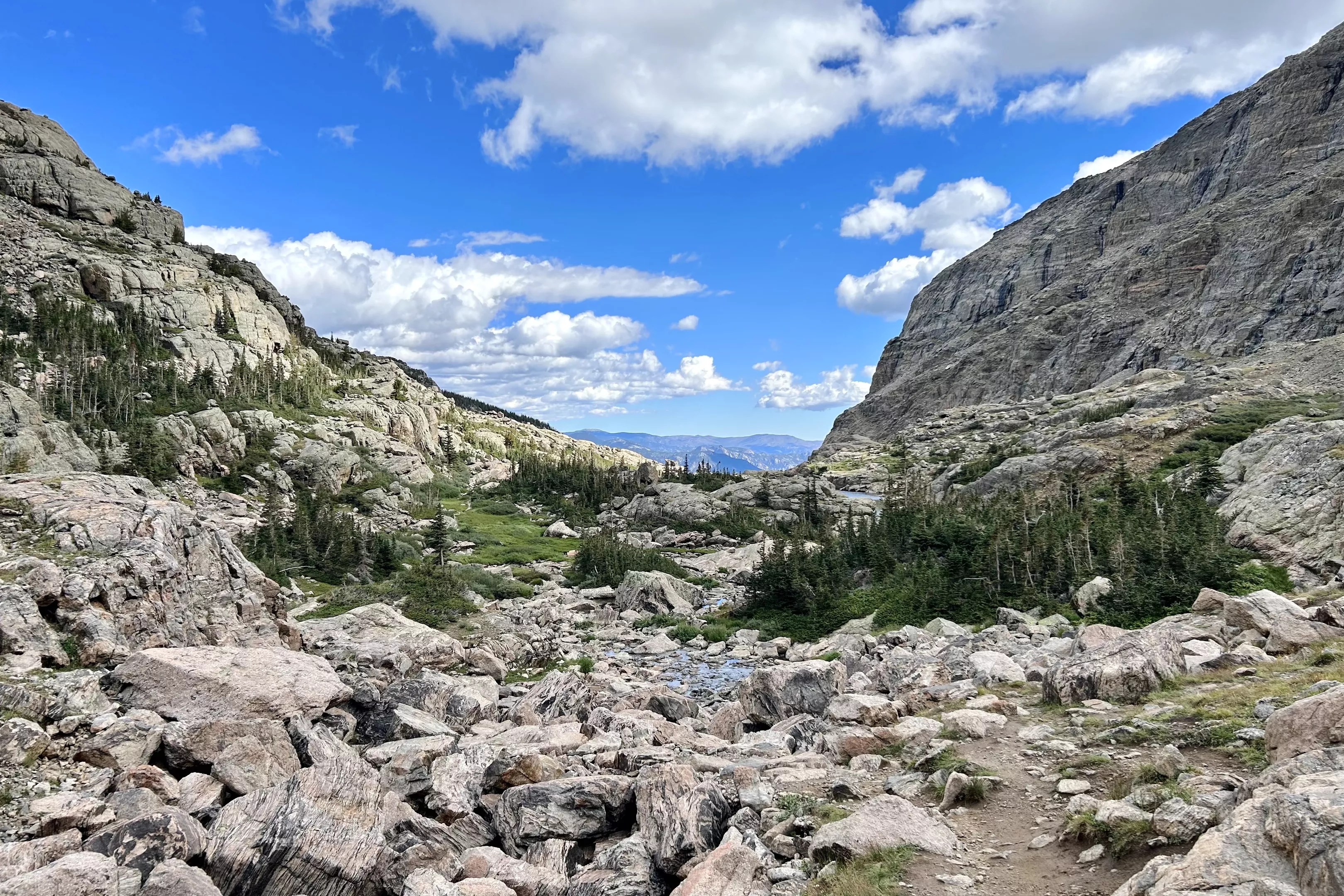 A boulder-strewn valley and distant peaks in Rocky Mountain National Park