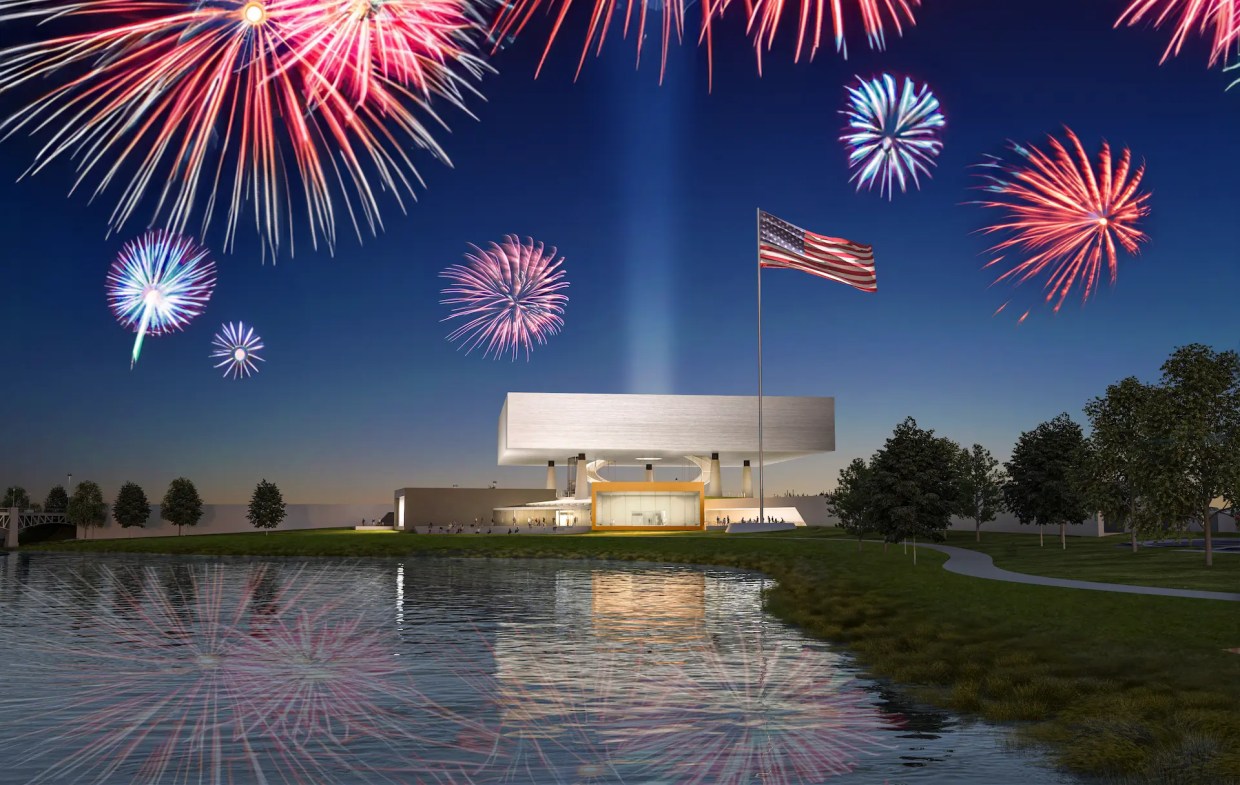 museum with water in front, fireworks behind