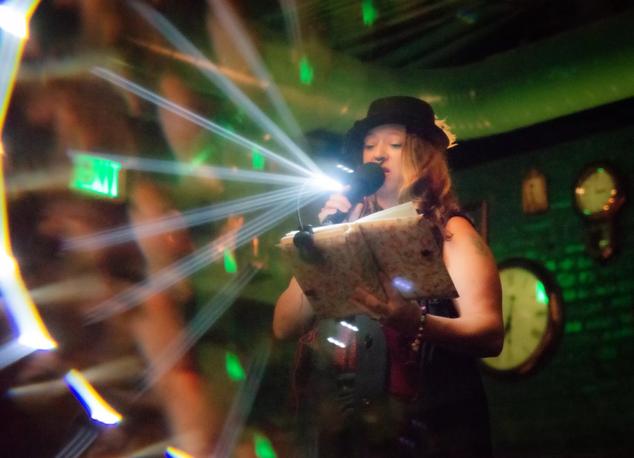 A woman speaks into a microphone