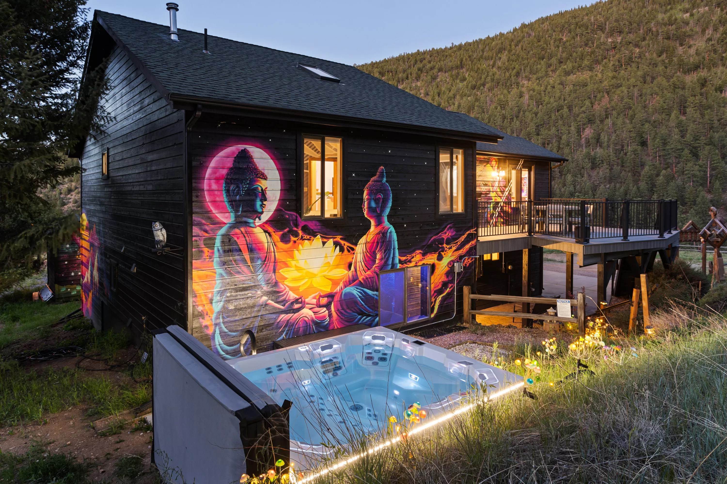 A colorful mural and hot tub