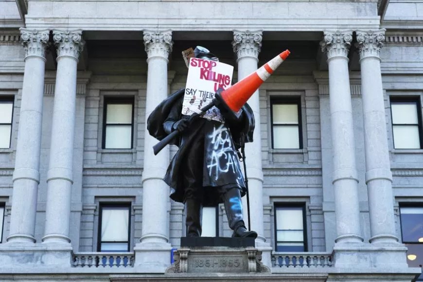 soldier statue with graffiti