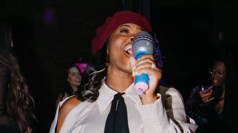 woman holding inflatable mic