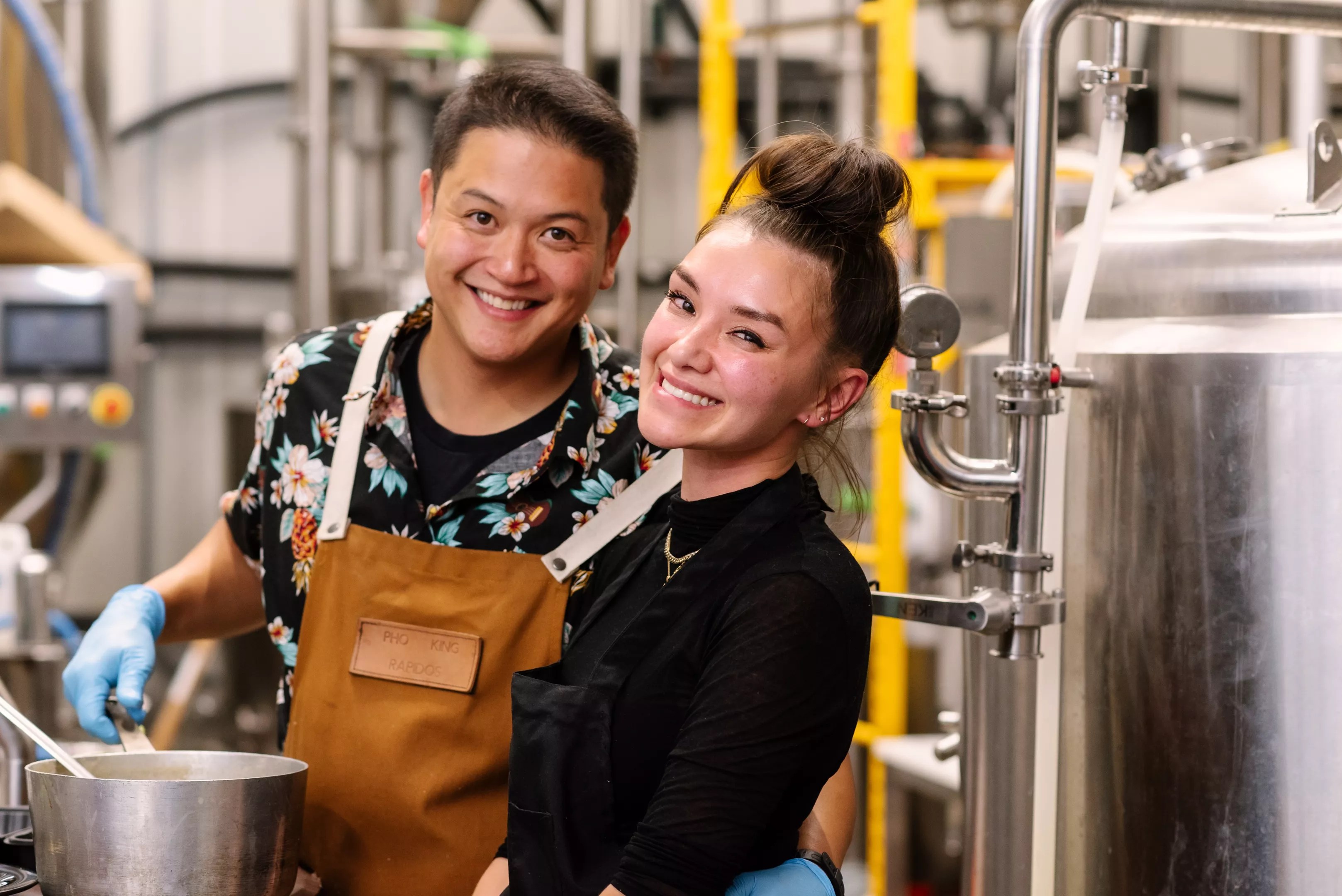 man and woman in aprons