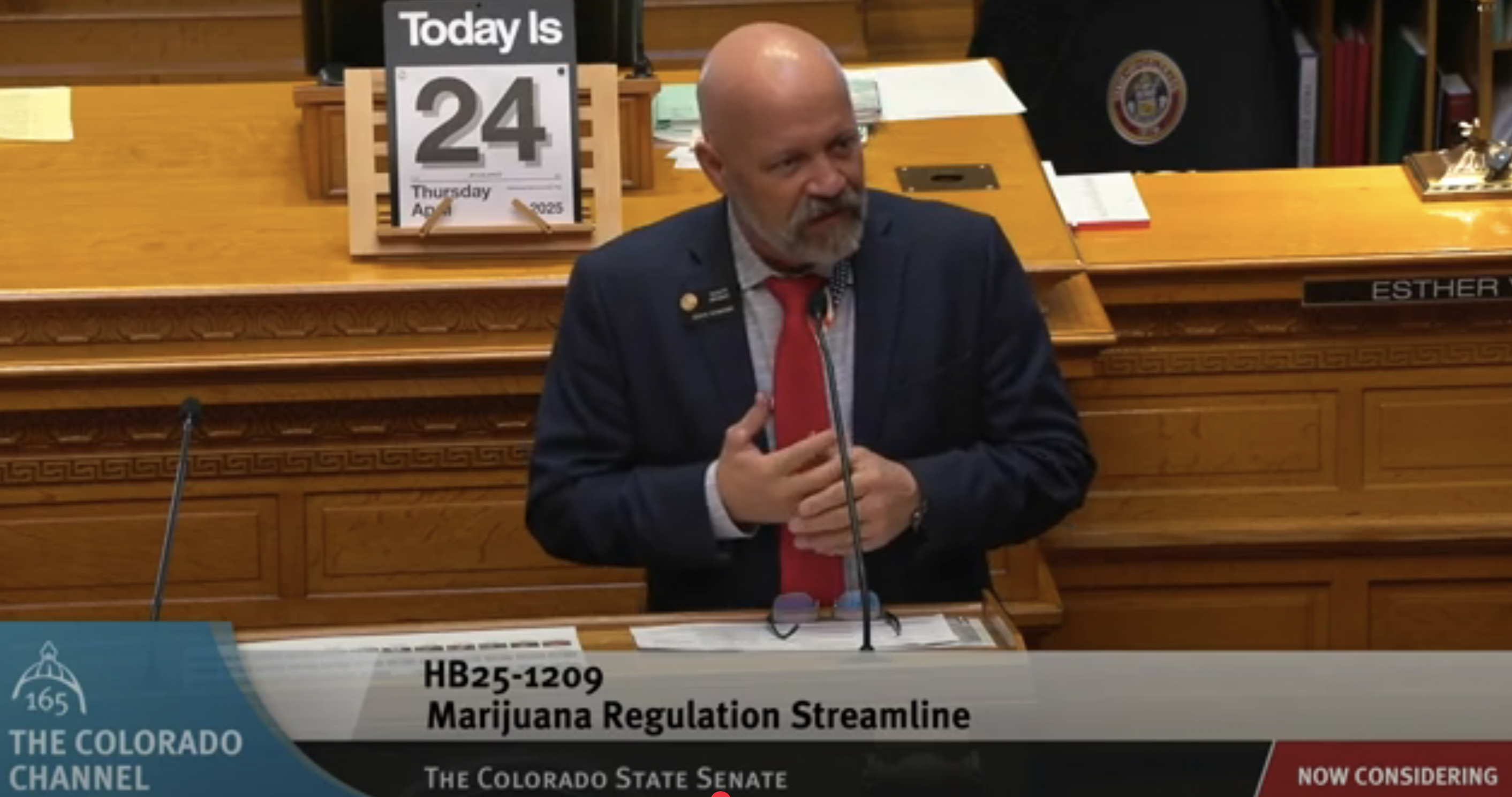 Senator speaks at podium before bill vote