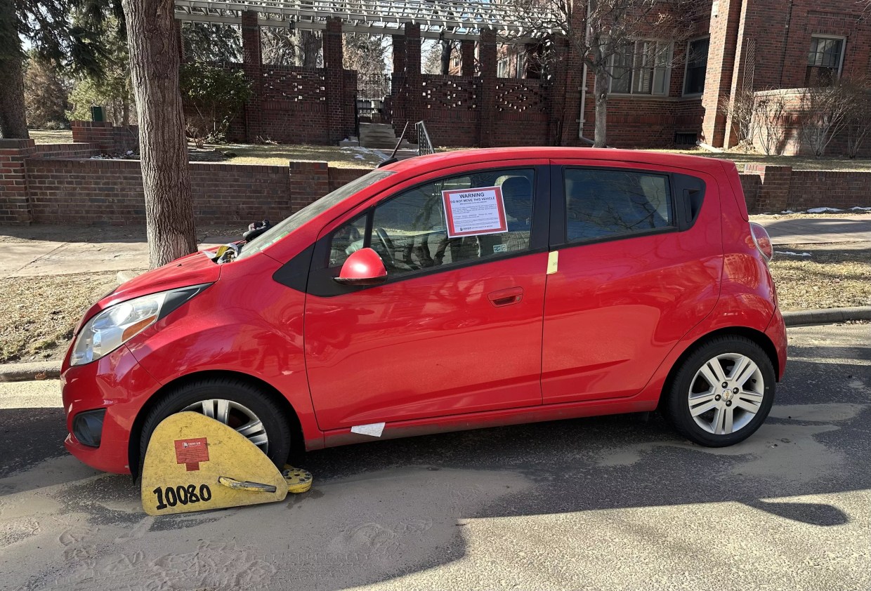 Abandoned car parked in Denver