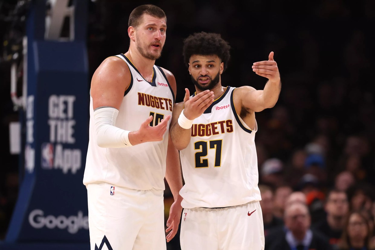 Nikola Jokic and Jamal Murray talk during game