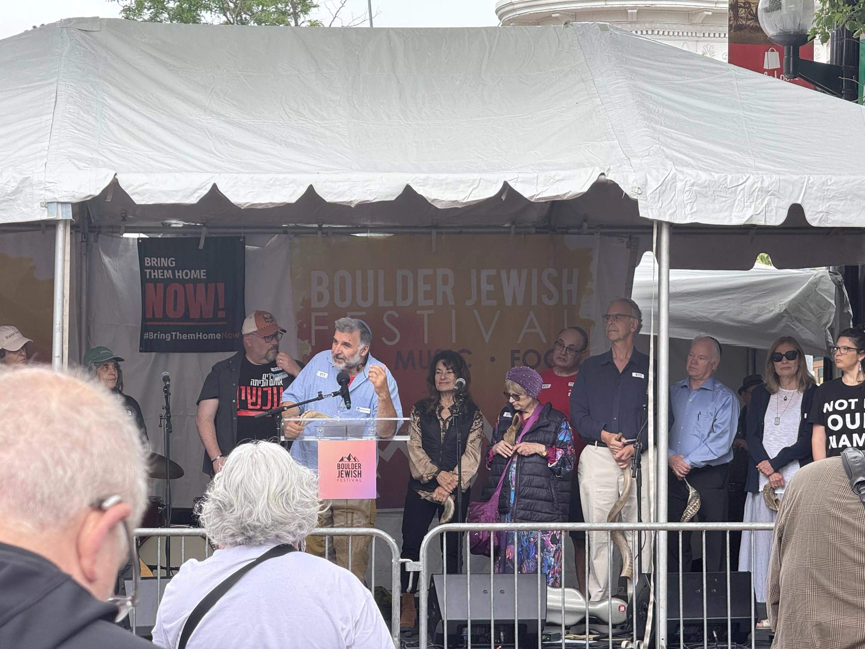 Rabbi Marc Soloway of Congregation Bonai Shalom in Boulder addresses attendees at the Boulder Jewish Festival a week after the firebombing terror attack