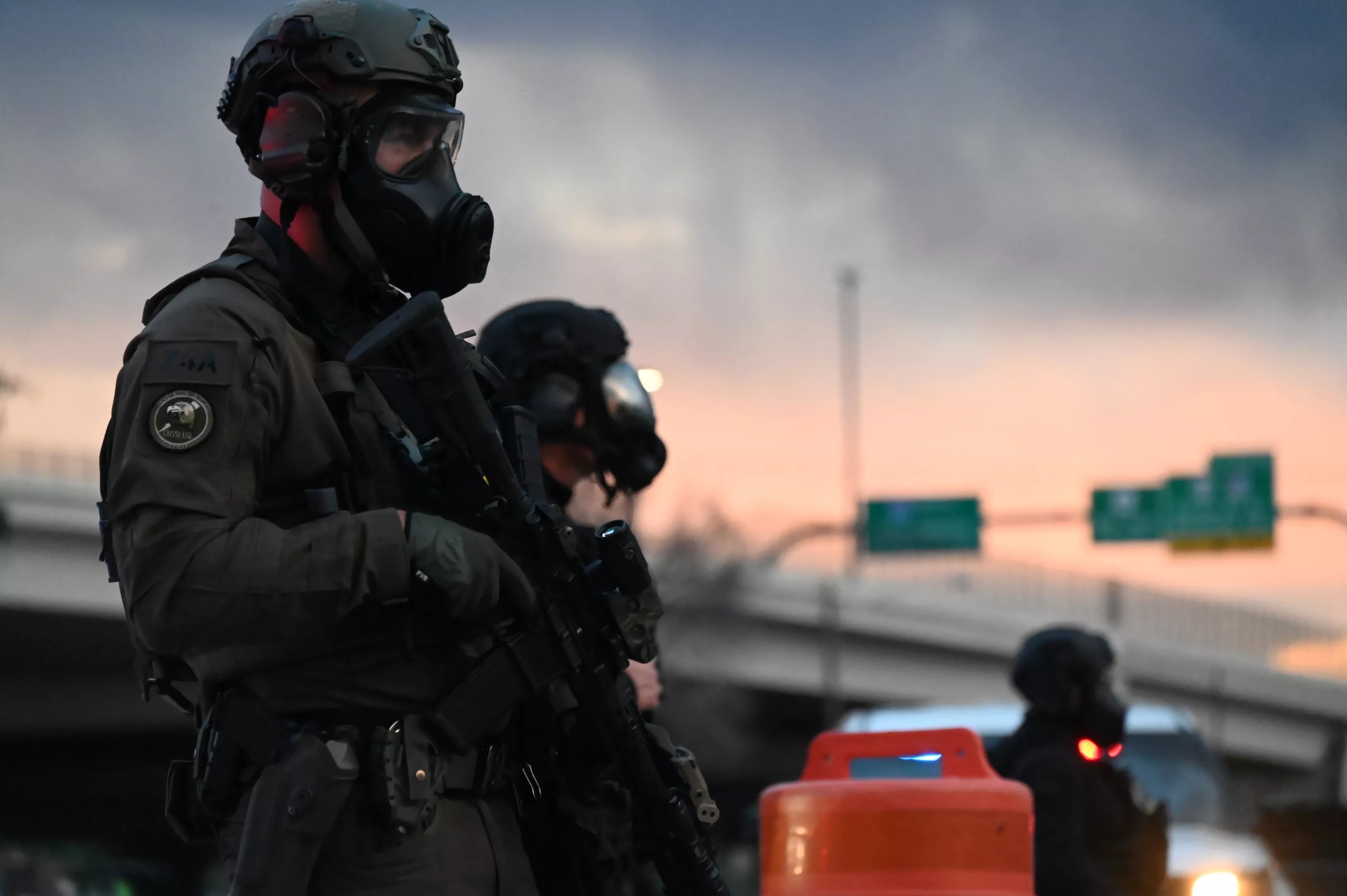 A man stands in the sundown.