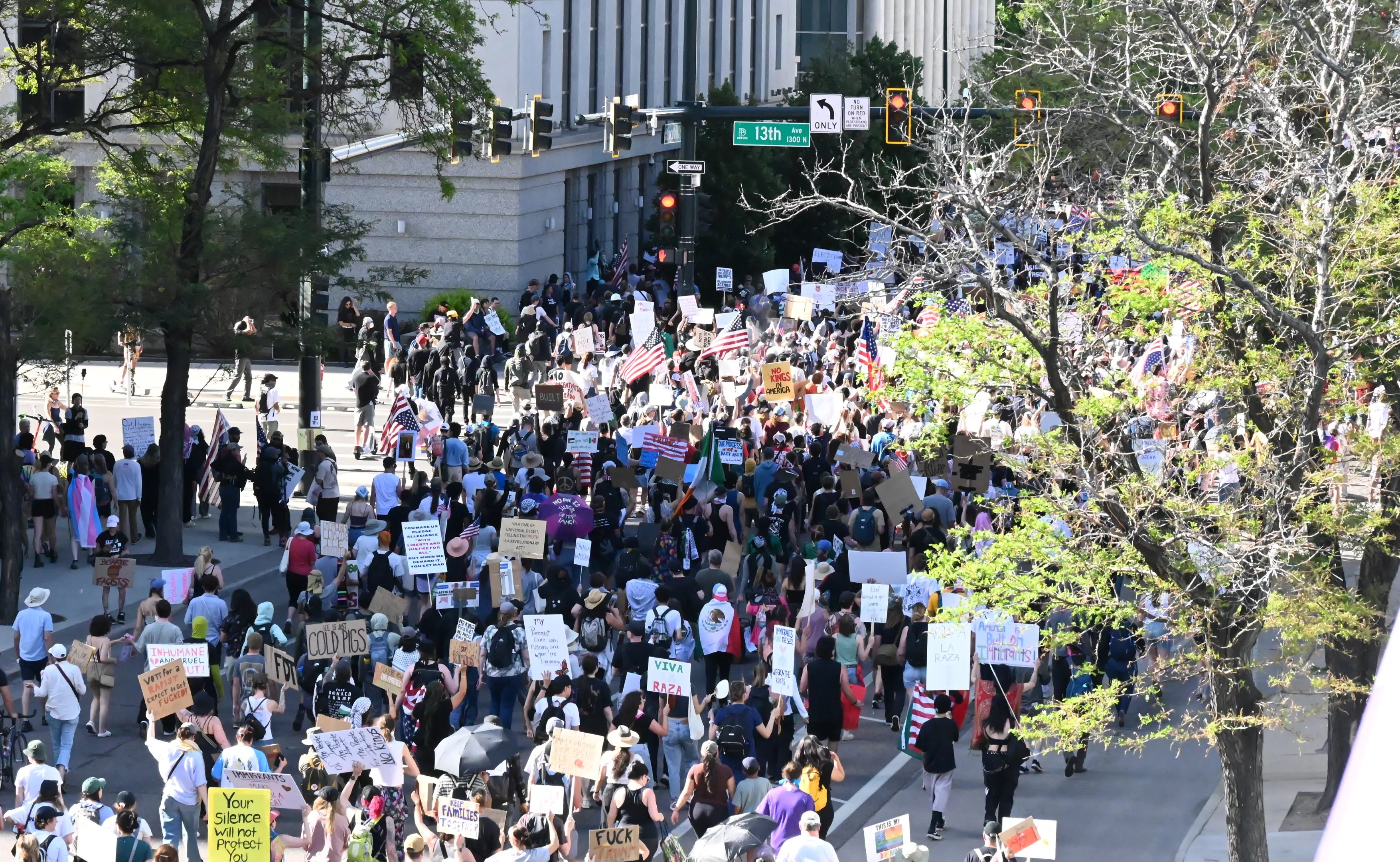 protesters march down Denver street