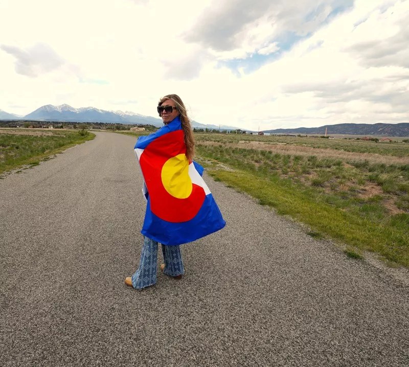 A woman wearing a colorado flag