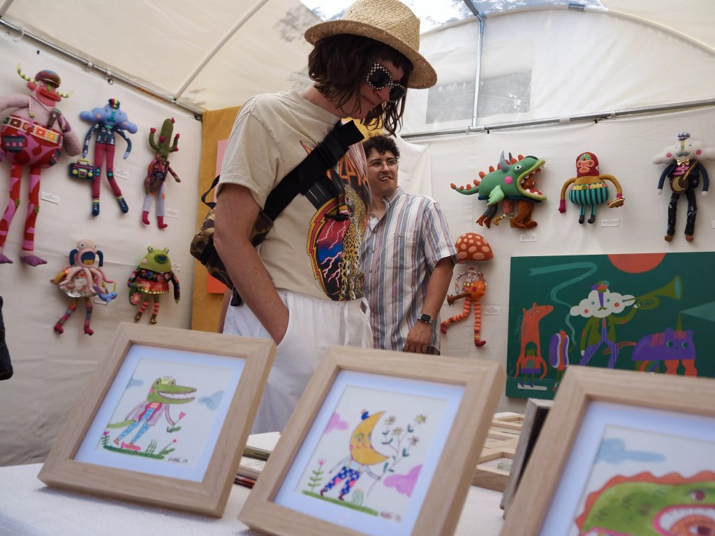 A person browses art