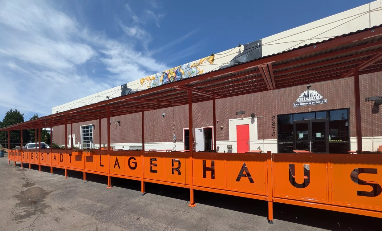 Covered patio with orange metal work.