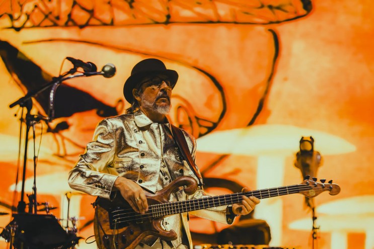 Les Claypool performing on stage at Red Rocks.