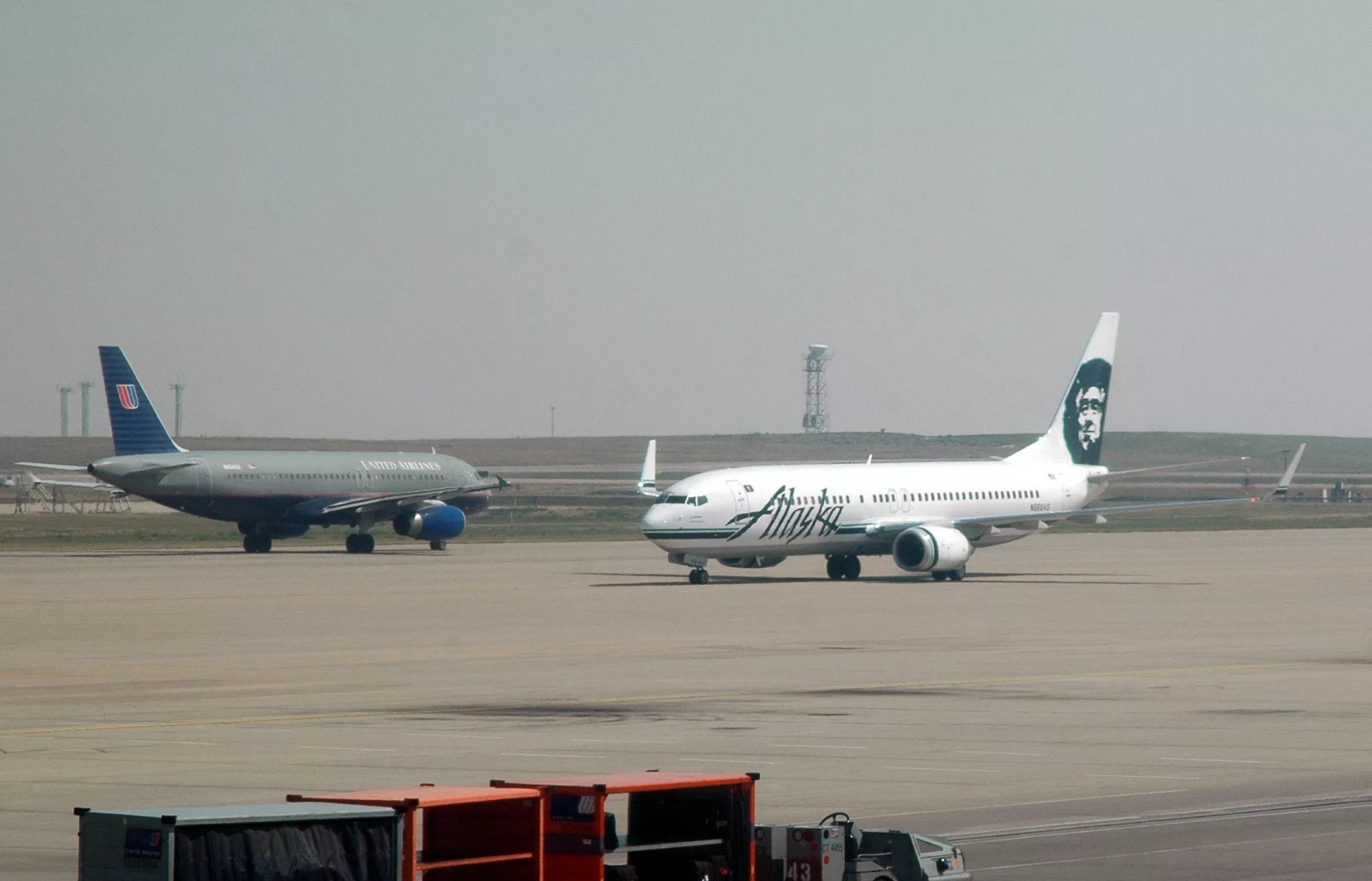 grounded united airlines and alaskan airlines planes on runway