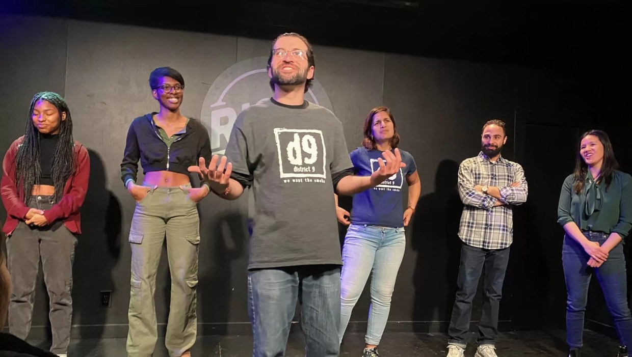 An improv team onstage.