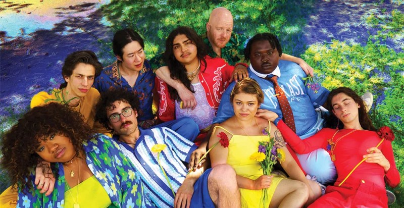 members of Denver band DOGTAGS lie on grass